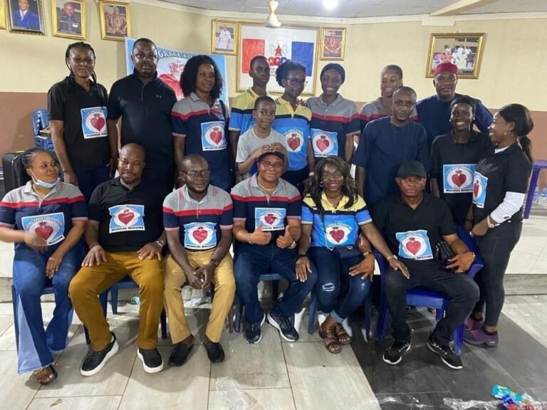 Group of Living Grace Foundation volunteers wearing branded medical mission shirts