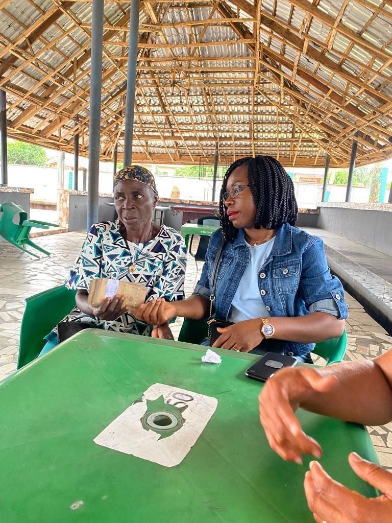 A widow receiving financial assistance from Living Grace Foundation staff